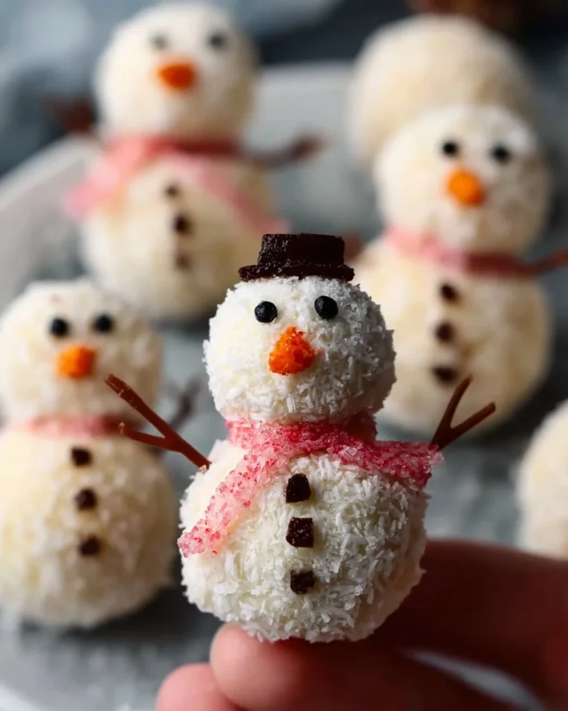 Cute no-bake snowmen truffles for holiday treats and festive celebrations.