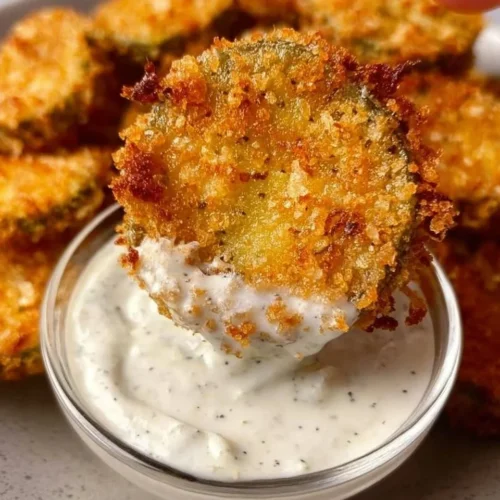 Crispy air fryer fried pickles served with a dipping sauce