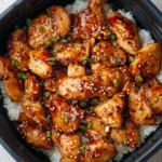 Air Fryer Teriyaki Chicken garnished with sesame seeds and green onions