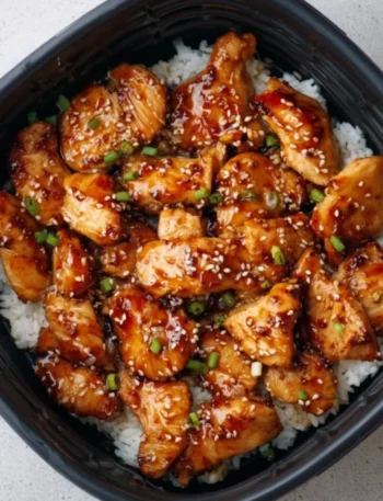 Air Fryer Teriyaki Chicken garnished with sesame seeds and green onions