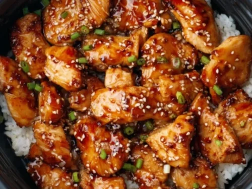 Air Fryer Teriyaki Chicken garnished with sesame seeds and green onions