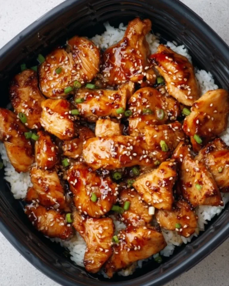 Air Fryer Teriyaki Chicken garnished with sesame seeds and green onions