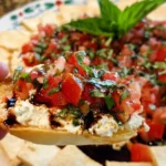Delicious Bruschetta Dip served with crispy bread and fresh toppings