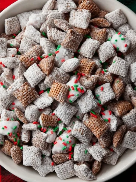 Delicious Christmas Puppy Chow with festive colors and toppings