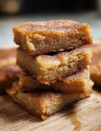 Freshly baked Cinnamon Sugar Blondies topped with a sweet cinnamon sprinkle