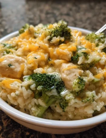 Crockpot Cheesy Chicken with broccoli and rice served in a bowl