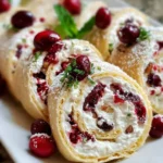 Festive Christmas Cranberry Roll Ups served on a holiday platter