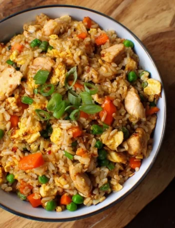 Delicious Hibachi Chicken Fried Rice served in a bowl garnished with vegetables.