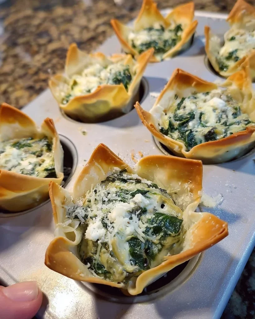 Delicious spinach and artichoke wonton cups served as a party appetizer.