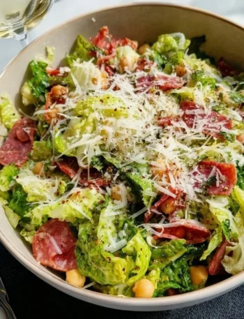 Delicious La Scala Chopped Salad served in a bowl, featuring fresh vegetables and flavorful ingredients.