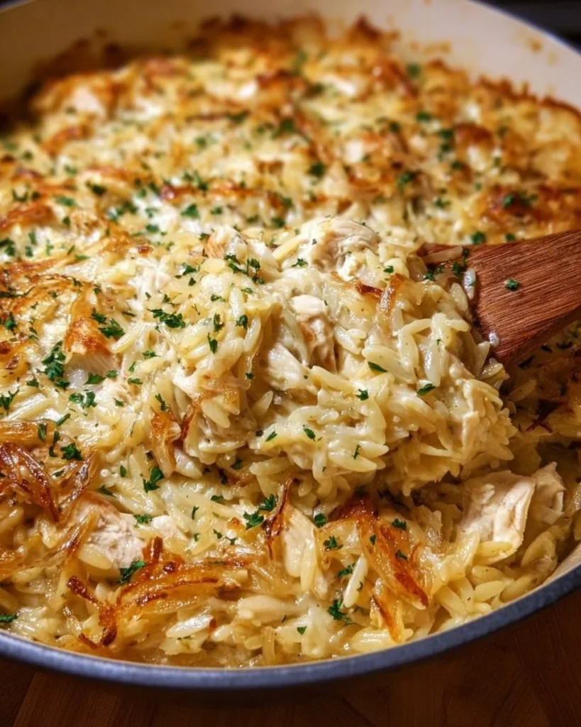 Delicious French Onion Chicken Orzo Casserole with melted cheese