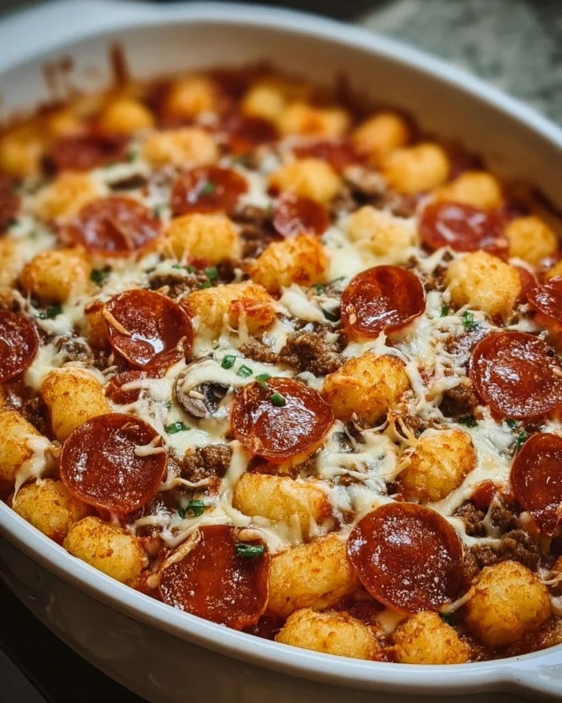 Delicious Pizza Tot Casserole topped with cheese and pepperoni in a baking dish