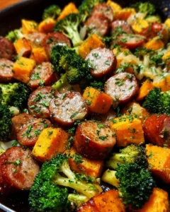 Sheet pan sausage and sweet potatoes with honey garlic sauce, caramelized and delicious.