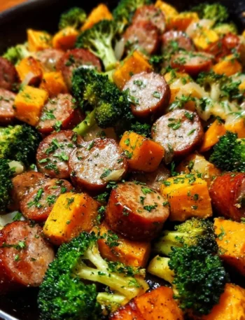 Sheet pan sausage and sweet potatoes with honey garlic sauce, caramelized and delicious.