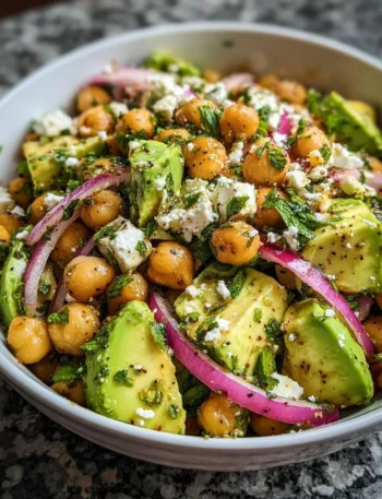 Chickpea Feta Avocado Salad with fresh ingredients in a bowl