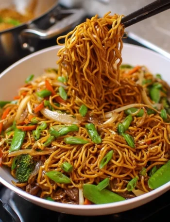 A plate of Classic Chinese Chow Mein with vegetables and chicken