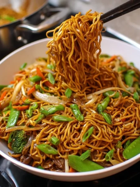 A plate of Classic Chinese Chow Mein with vegetables and chicken