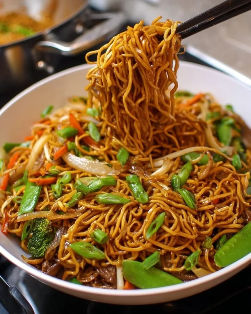 A plate of Classic Chinese Chow Mein with vegetables and chicken