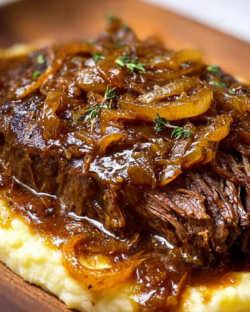 Delicious Juicy French Onion Pot Roast served with caramelized onions