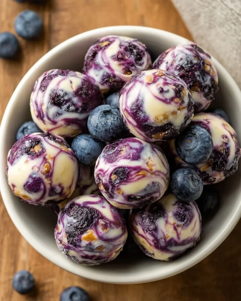 Blueberry Greek yogurt bites on a white plate, a healthy snack option.