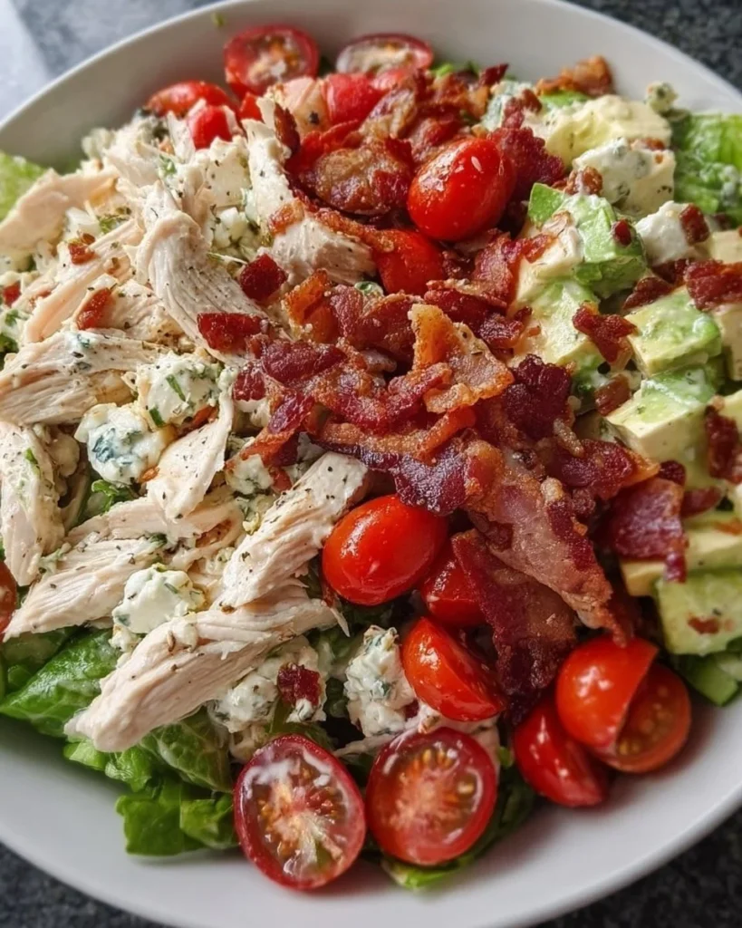 Savory BLT chicken salad with bacon, lettuce, and tomatoes in a bowl